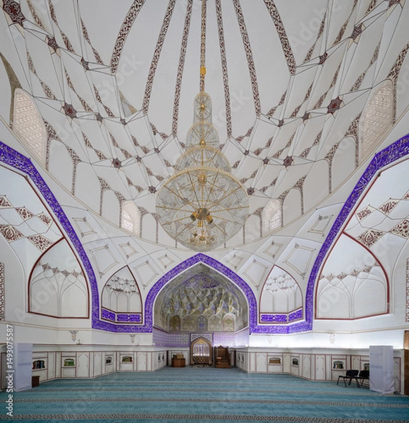 Fototapeta interior architecture of a grand beautiful white mosque in white and blue concept with blue azure color carpet