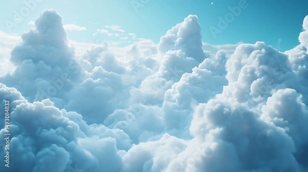Fototapeta Fluffy clouds against a clear sky
