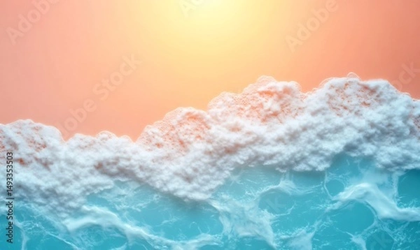 Fototapeta Soft waves with white foam gently washing up on a sandy beach creating beautiful patterns under a warm sunset glow