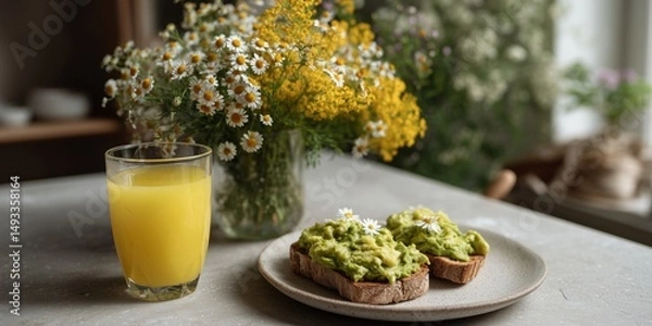 Fototapeta Bright and airy brunch with avocado toast and fresh juice setting