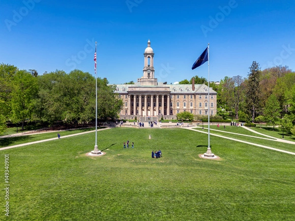 Fototapeta The Old Main building in the campus of Penn State University aerial view in spring sunny day, State College, Pennsylvania.