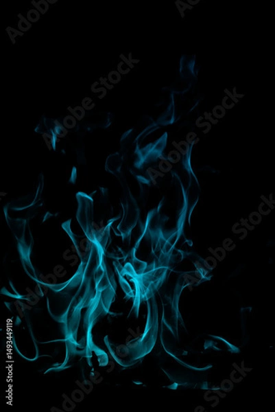 Fototapeta Blue Flame Dance on Black Background with Ethereal Light Glow