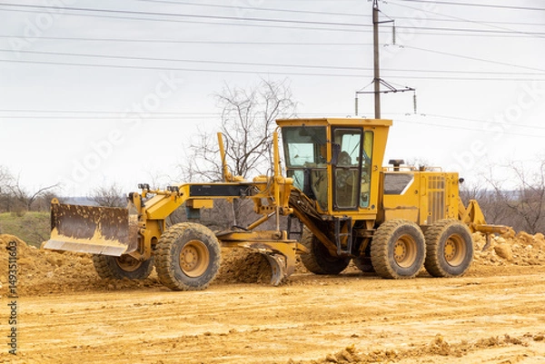 Fototapeta Motor grader on a construction site. Road construction.