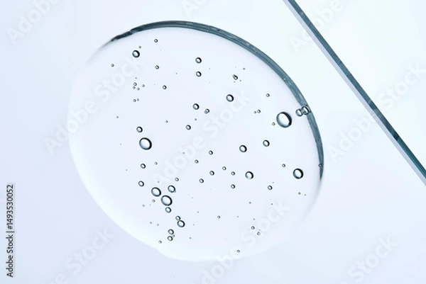Fototapeta Cleansing micellar gel for face wash in a tube on a blue background.