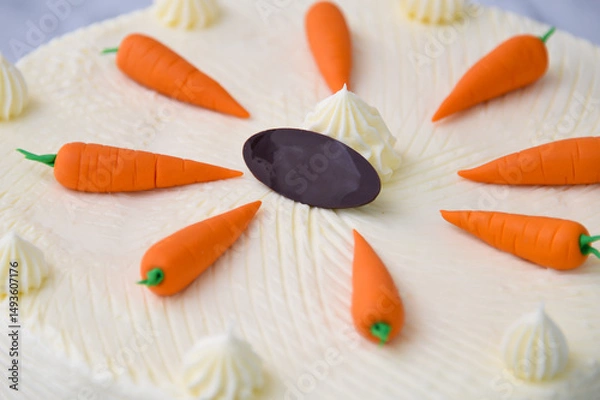 Fototapeta Decorated Carrot Cake, featuring moist and spiced cake layers covered in smooth cream cheese frosting closeup view of delicious cake