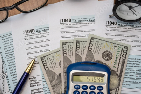Fototapeta tax forms, calculator, pen dollar money on desk. View from above. Time for tax