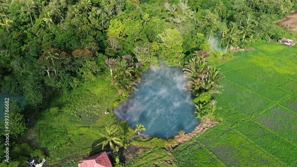 Fototapeta Aerial View of Sulphur Thermal Lakes for Swimming in Ranolewo, Tomohon – Volcanic Landscape and Rice Fields in North Sulawesi, Indonesia..