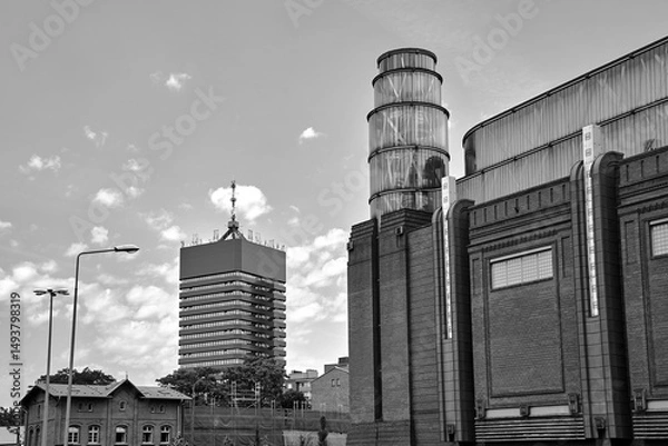 Obraz Former brewery tower and modern office building in the city of Poznan