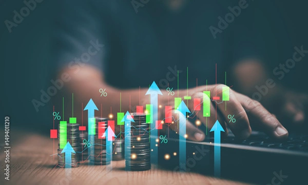 Fototapeta Businessman using laptop with heap of coins and arrow up with percentage symbol for financial increase interest rate or mortgage investment dividend from business growth concept. Saving money.