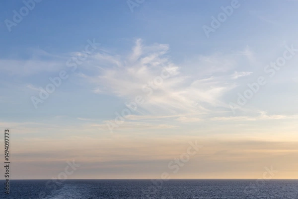 Fototapeta Serene Sunset Over Pacific Ocean With Soft Clouds in BC, Canada