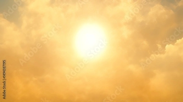 Obraz Bright sun shining through hazy, golden clouds.