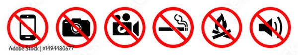 Fototapeta Set of prohibition signs with red circles and slashes indicating no mobile phones, no photography, no videography, no smoking, no fire, and no loud noise. Ideal for safety and warning use.