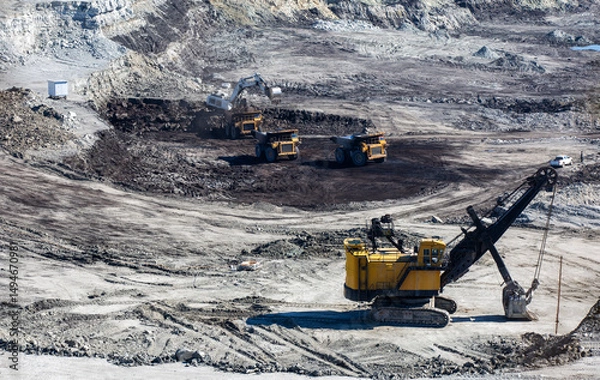 Fototapeta Panoramic aerial view of coal mine. Open pit mine industry, big yellow mining truck for coal quarry. Open coal mining anthracite mining. Pit on coal mining by open way. 