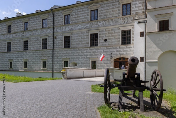 Obraz Old cannon near Royal Tower and entance gate to Krasiczyn Castle, Poland