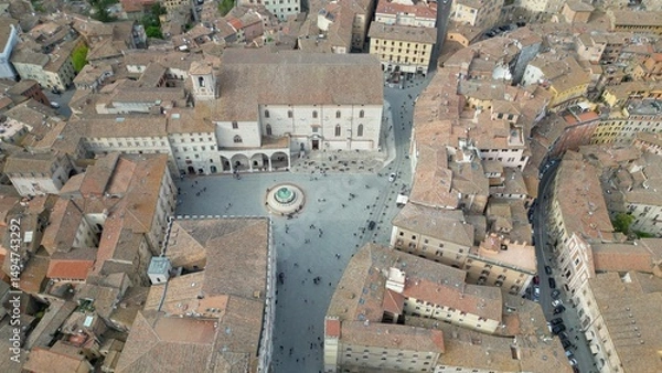 Fototapeta Italy, Umbria, Perugia drone aerial view .The Fontana Maggiore, located in Piazza IV Novembre ( Piazza Grande), is the symbolic monument of the city of Perugia and the roofs of the houses 