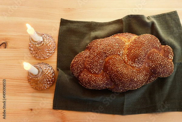 Fototapeta Image of Shabbat, challah bread, wine and candles