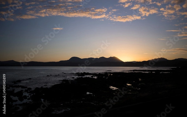 Fototapeta Views out across Gruinard Bay towards the summit of An Teallach at sunrise in the North West Scottish Highlands in the UK