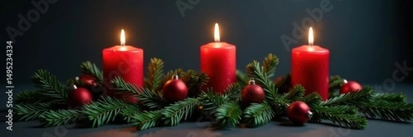 Obraz Three candles burn brightly on fir branches, adorned with festive ornaments, against a dark grey backdrop , celebration, winter