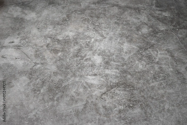 Fototapeta A grey concrete floor with a few scratches. The floor is very smooth and has no visible lines