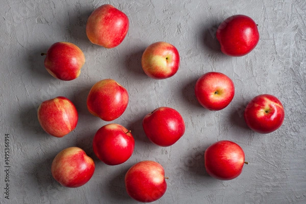 Obraz Scattered Red Apples on Light Gray Concrete Background