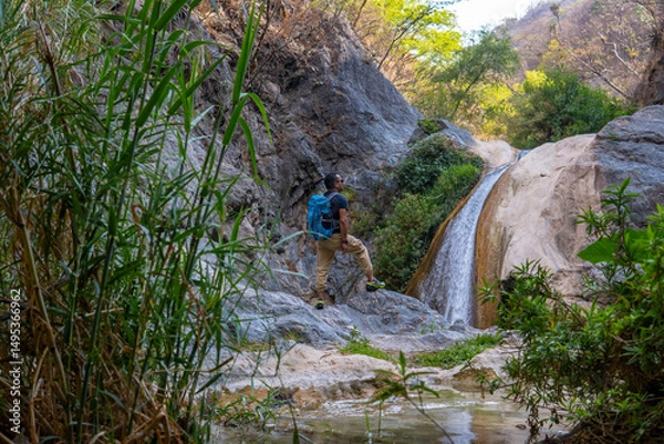 Obraz Hiker admiring the la magdalena waterfalls in tlatlauquitepec, puebla, mexico