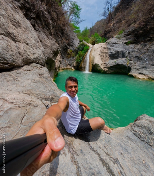 Obraz Tourist taking a selfie at la magdalena waterfalls