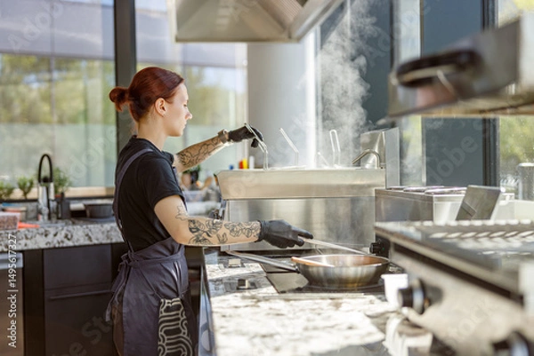 Obraz In a beautifully stylish kitchen, a highly skilled chef diligently works with great precision amidst billowing steam