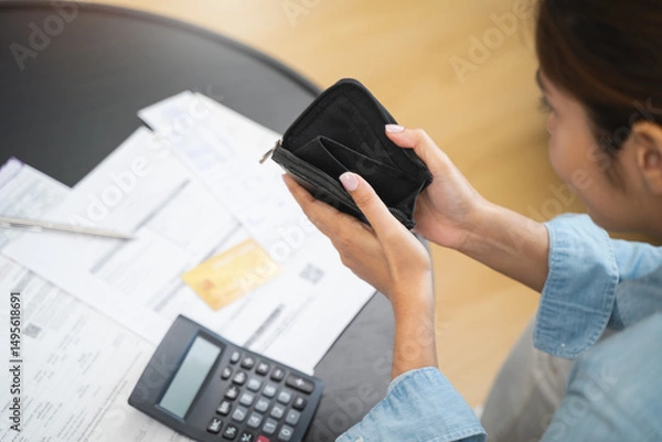 Fototapeta person opening wallet on the table have invoice and loan document.