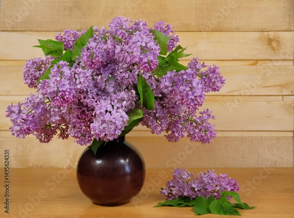 Fototapeta Bouquet of lilacs in a ceramic vase