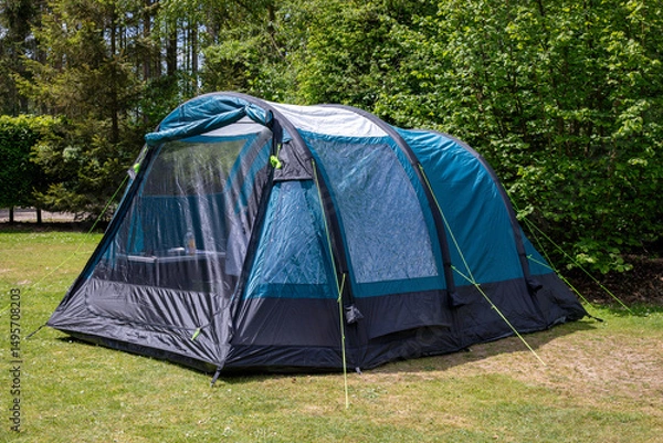 Fototapeta An air tent set up for camping in a forest campsite