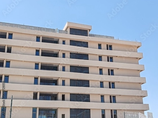 Obraz Residential Cream Color Multi Story building modern design Exterior View with Balcony black glass windows.
Aluminum Baffle Shape Cladding Balcony Facade Architecture Panel Decoration Horizontal Tower.