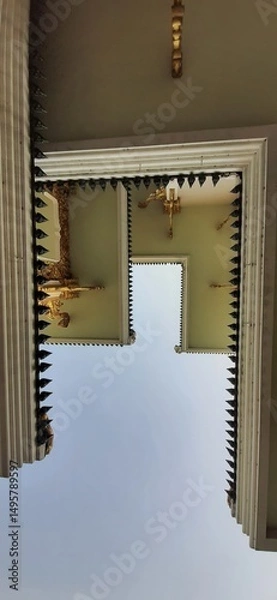 Obraz Classic Architectural View of Temple Structure with Ornate Decorations and Unique Design Elements