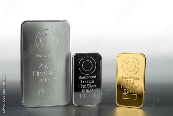 Obraz Gold and silver bars of various weights on a gray background.