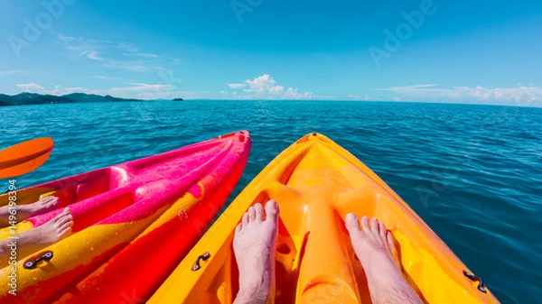 Obraz Two colorful kayaks floating in the ocean near a Fiji island in the south pacific 
