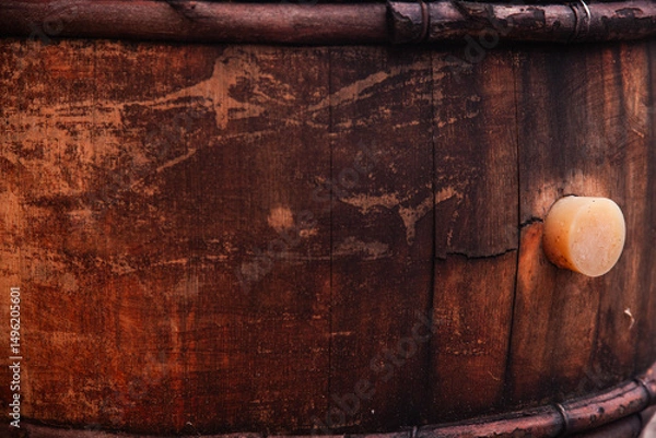 Fototapeta A wooden barrel with a cork inserted into it.