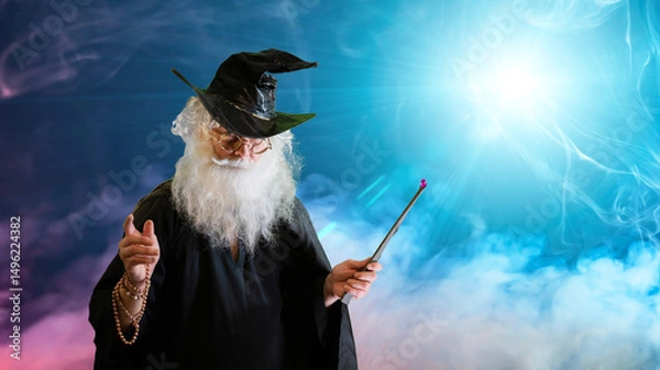 Fototapeta Wizard old man casting spell with magic wand