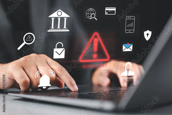 Fototapeta Scam alert warning. Cybersecurity concept. Man using laptop, warning sign for scams with icons representing online threats, phishing, and cybersecurity. Unknown person, suspicious scammer, fraud,