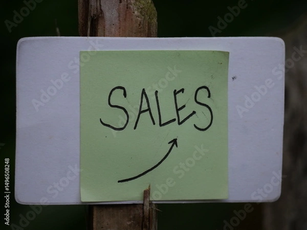 Fototapeta The word "sale" is boldly written on the hand, drawing attention for promotion purposes.