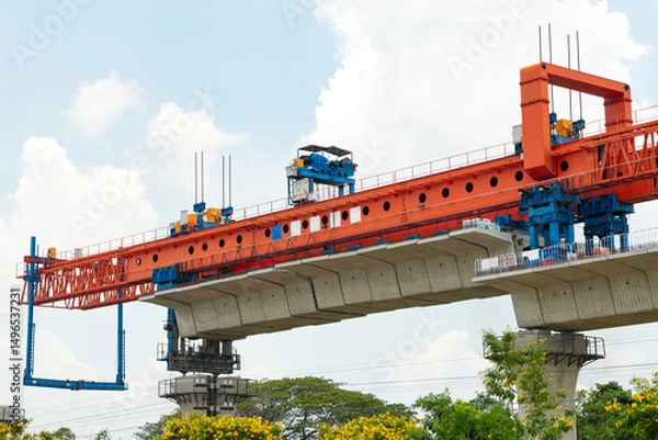 Obraz High speed train infrastructure under construction with advanced machinery in clear blue skies