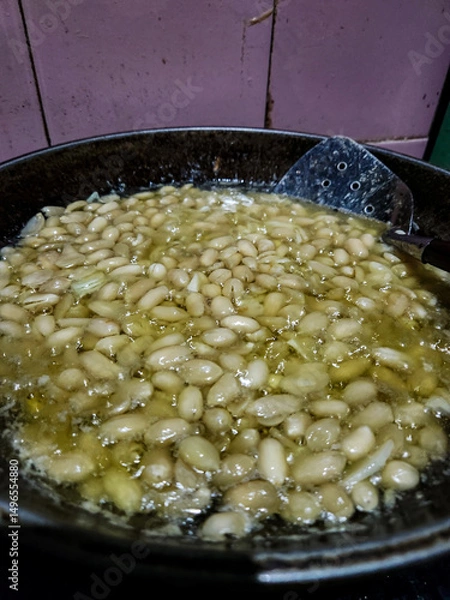 Obraz fried peanuts in a frying pan