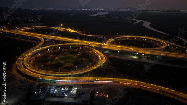 Fototapeta India's longest sea bridge: Trans-Harbour Sea Link. Atal Setu sea bridge in Mumbai, Maharashtra, India. Time-lapse of a city at night with bright skyscrapers and a dense network of glowing buildings.