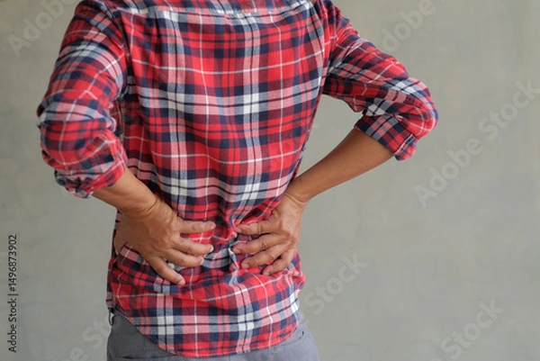 Fototapeta man suffering from back pain, have a backache, health problems, human pain concept.