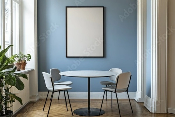 Fototapeta Cozy room with a blank frame, round table and chairs