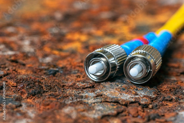 Obraz Fiber optic patch cords in telecommunication optical network on rusted corroded metal background