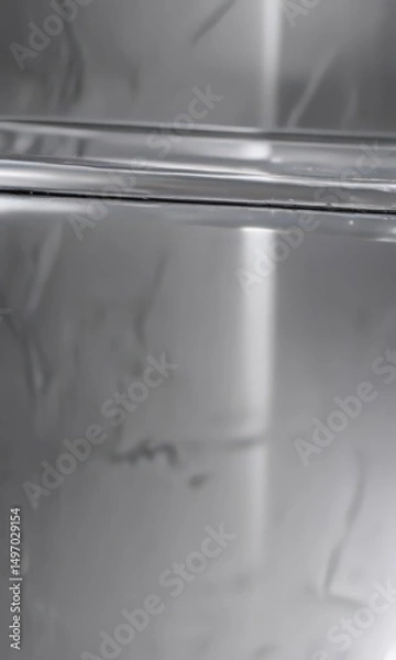 Fototapeta Gleaming silver surface, polished to a mirror sheen, metal, reflective texture