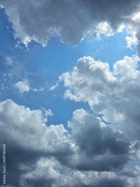 Obraz Beautiful sky with cumulus clouds. Blue sky clouds background, beautiful landscape with clouds. Clear blue sky and white clouds. High resolution wallpaper. Sunny day. Clean blue sky for background.