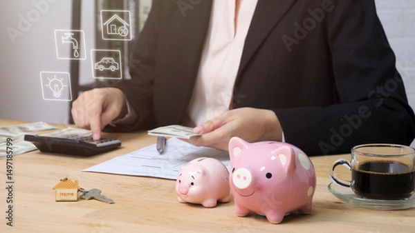 Fototapeta Allocate money for household expenses concept. people use calculator to calculate and divide money into bills for house utility payment. home budget investment strategy management.