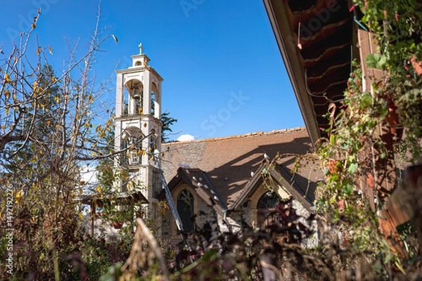 Obraz White bell tower reaching for the sky in Platanistasa village, Cyprus