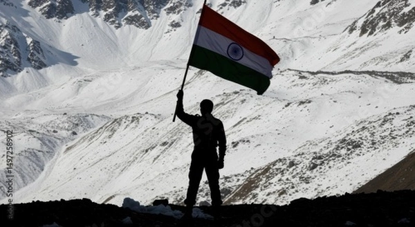 Fototapeta Patriot Standing on Mountain Peak Holding the Indian Flag Amid Snowy Landscape