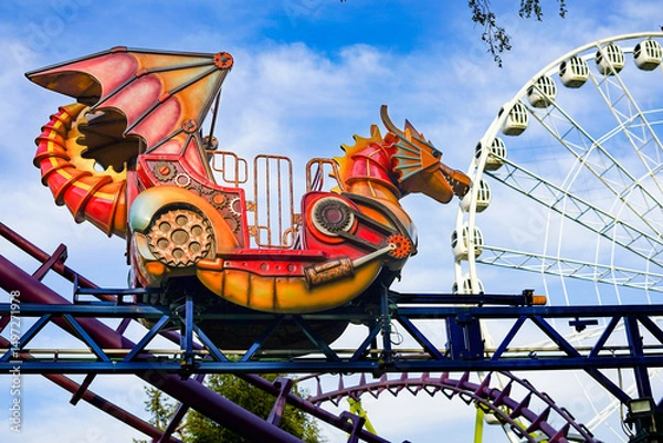 Fototapeta Dragonthemed roller coaster at an amusement park